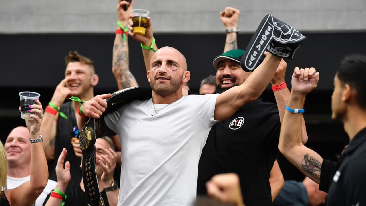 UFC champ Alex Volkanovski celebrates after defending featherweight title against Brian Ortega at UFC 266.