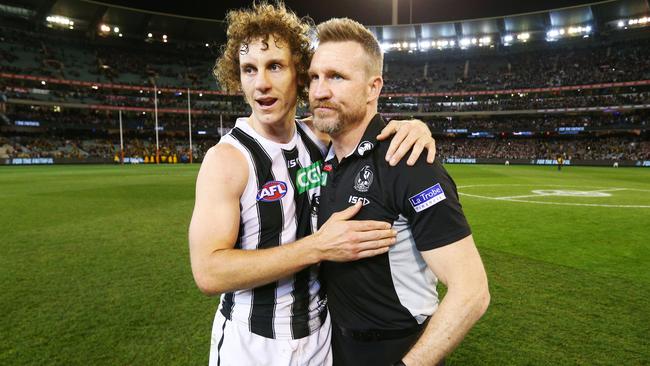 Nathan Buckley celebrates the win with Chris Mayne.