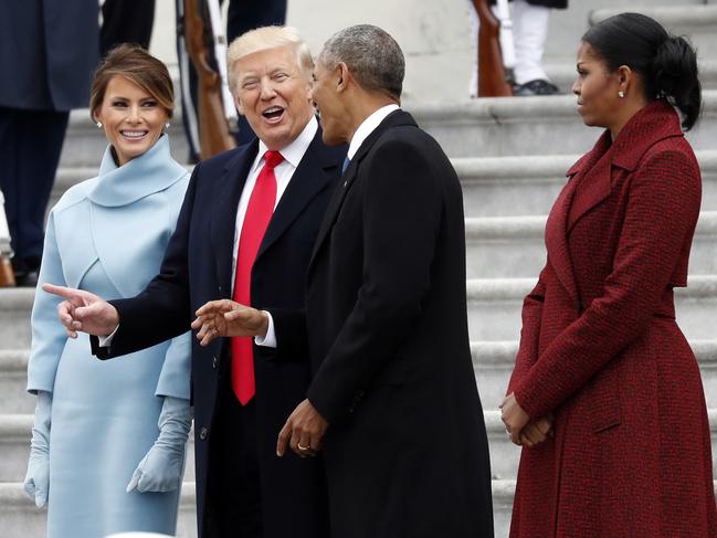 President Donald Trump and first lady Melania Trump talk with former President Barack Obama and Michelle Obama during a departure ceremony on the East Front of the U.S. Capitol in Washington on January 20, 2017, after Trump was inaugurated. Picture: AP
