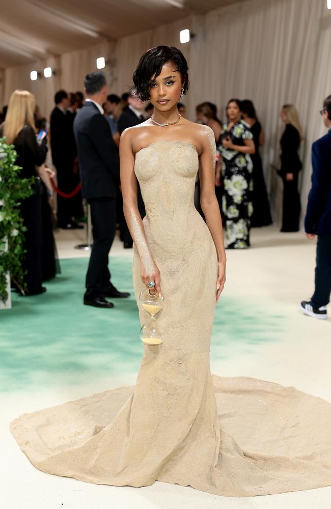 Tyla attends the 2024 Met Gala in a dress made with sand. In order to make it up the famous staircase, she had to be carried by assistants. Picture: Dimitrios Kambouris/Getty Images for The Met Museum/Vogue