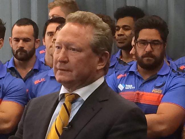 Billionaire and philanthropist Andrew Forrest is flanked by Western Force players during a media conference at Rugby WA Headquarters in Perth, Wednesday, August 30, 2017. Forrest says the ARU ambushed the Western Force, and they only axed the franchise because it carried a lower legal risk than the other teams. (AAP Image/Justin Chadwick) NO ARCHIVING