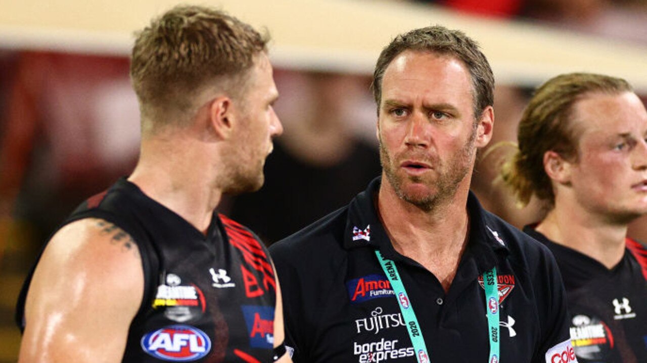 DARWIN, AUSTRALIA - AUGUST 22: Bombers assistant coach Ben Rutten speaks to Jake Stringer at the break during the round 13 AFL match between the Essendon Bombers and the Richmond Tigers at TIO Stadium on August 22, 2020 in Darwin, Australia. (Photo by Daniel Kalisz/Getty Images)