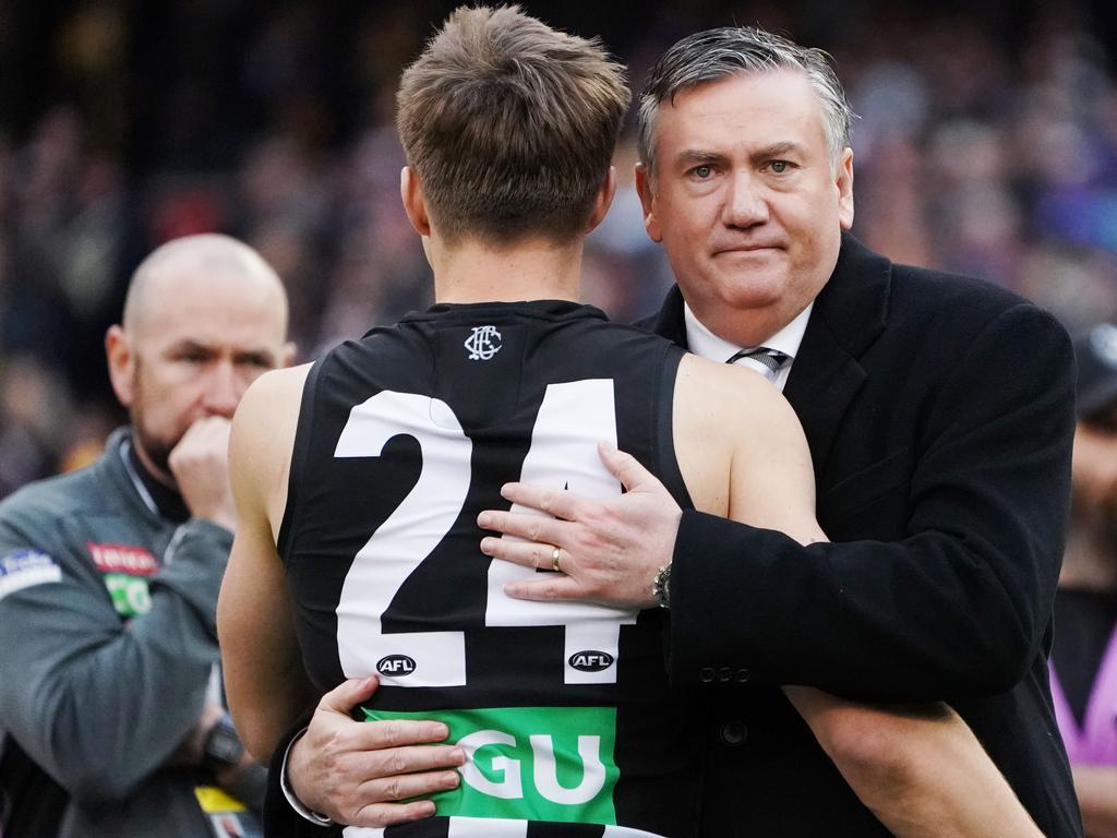 McGuire hugs Josh Thomas after the 2018 Grand Final loss.