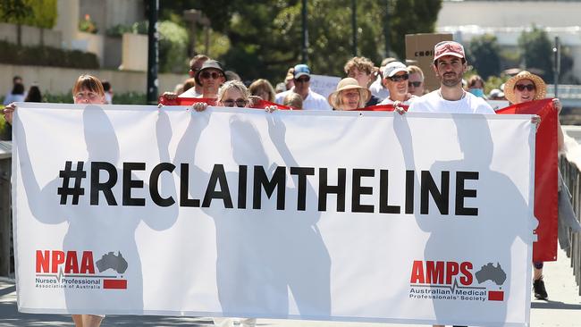 In scenes from the pandemic, workers from multiple sectors attend the #ReclaimTheLine protests in Brisbane in 2021. Picture: Jono Searle