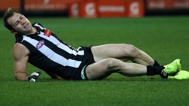 Magpie Travis Cloke injured after landing awkwardly in a marking contest. Picture: George Salpigtidis