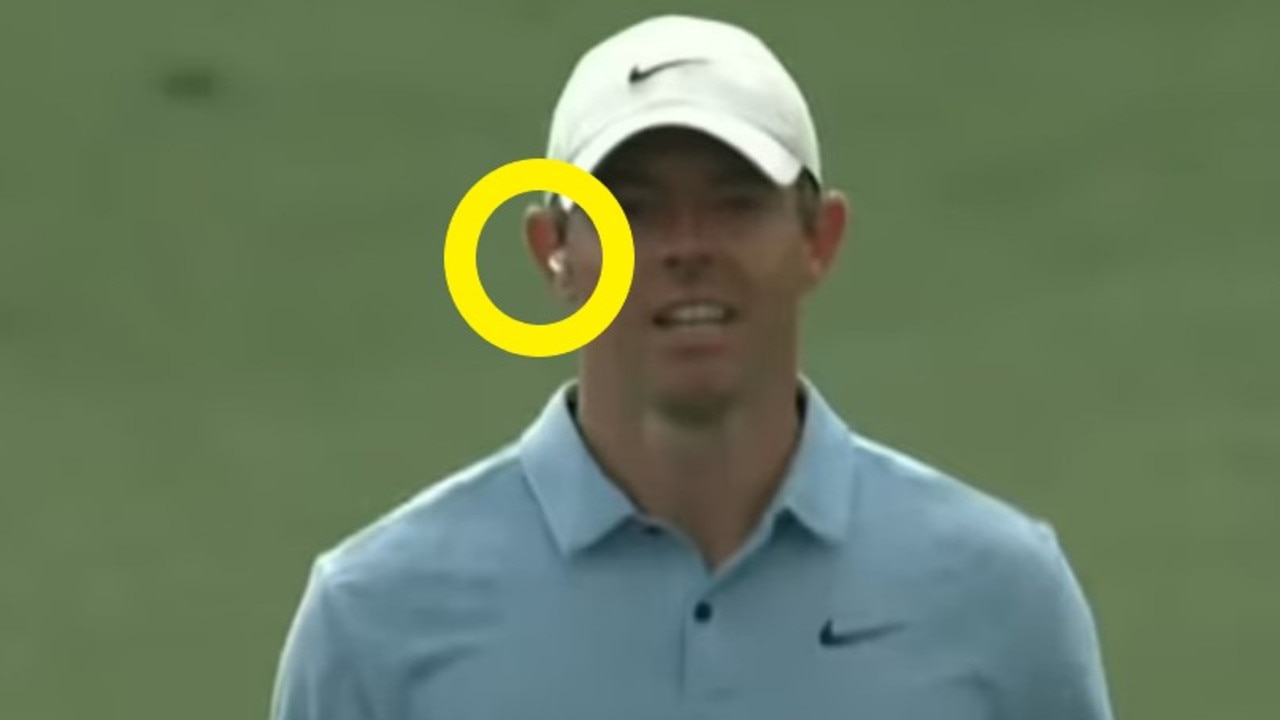 Rory McIlroy with one Airpod in.