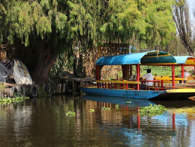 A tour boat arrives at Isla de las Munecas, Xochimico, Mexico. Picture: Px-lga