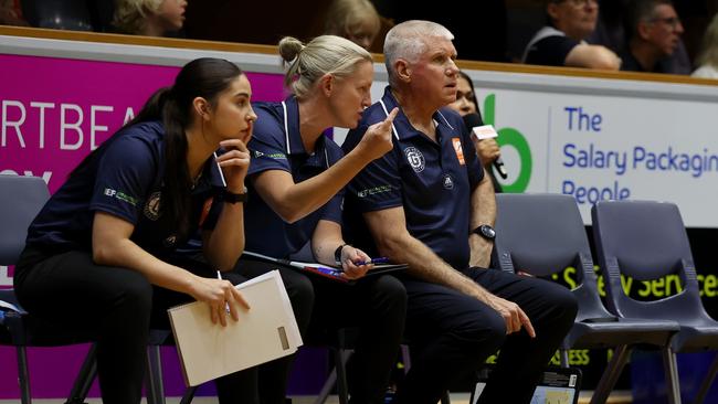 GEELONG, AUSTRALIA - OCTOBER 30: Chris Lucas, Head Coach of Geelong United and Hannah Lowe, Assistant Coach of Geelong United confer during the round one WNBL match between Geelong United and Townsville Fire at The Geelong Arena, on October 30, 2024, in Geelong, Australia. (Photo by Kelly Defina/Getty Images)