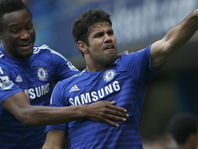 Chelsea's Diego Costa, right, celebrates after scoring his sides second goal of the game during their English Premier League soccer match between Chelsea and Arsenal at Stamford Bridge stadium in London Sunday, Oct. 5, 2014. (AP Photo/Alastair Grant)