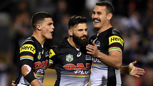 Josh Mansour of the Panthers celebrates with Nathan Cleary and Reagen Campbell-Gillard.