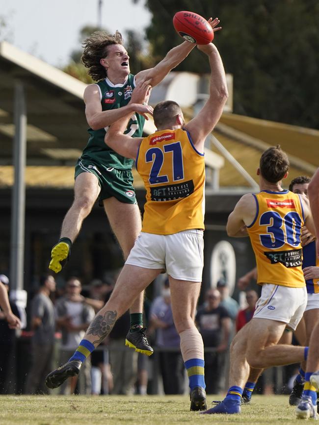 Tom Brindley battles Patrick Flynn. Picture: Valeriu Campan