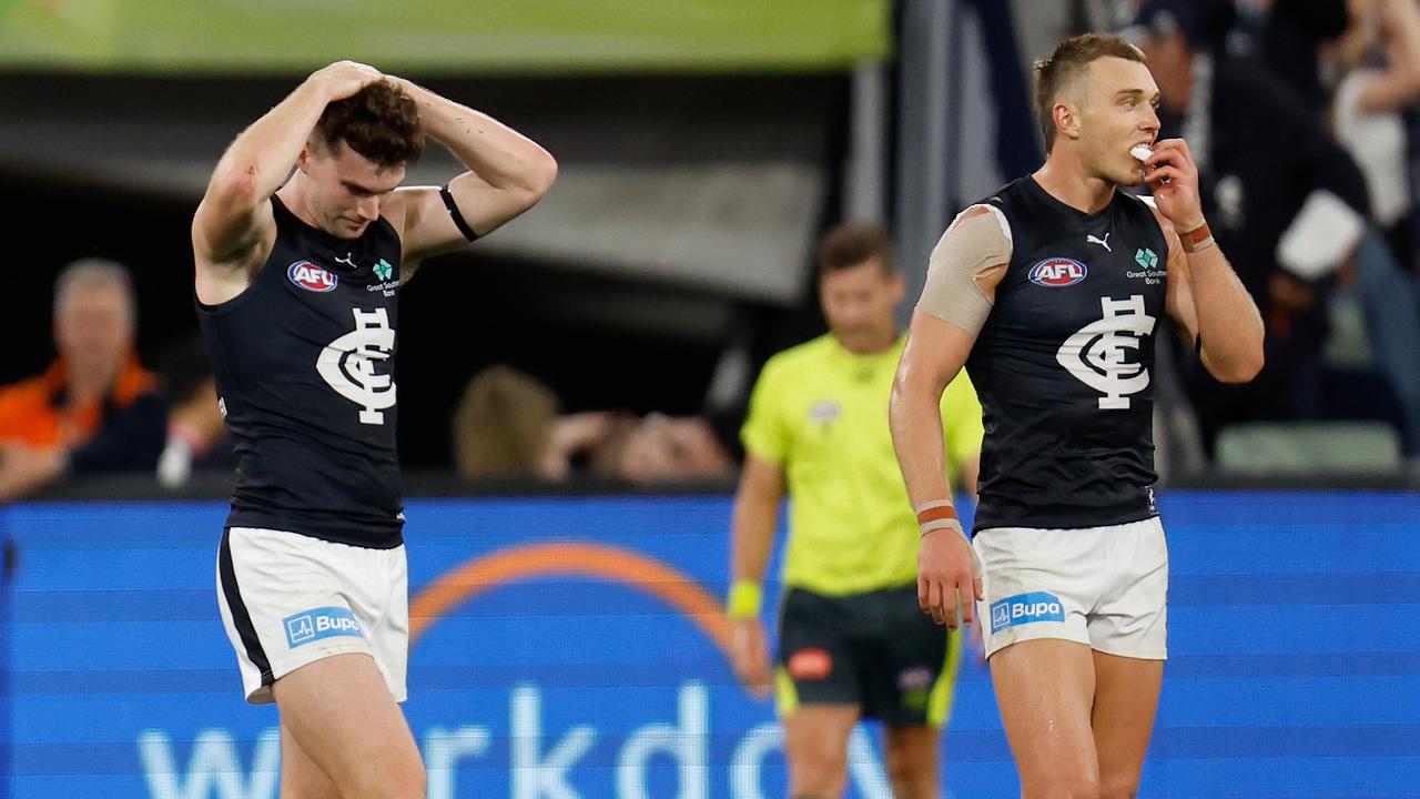 Blake Acres and Patrick Cripps can’t believe the season-opener ended in a draw. Picture: Michael Willson/AFL Photos via Getty Images