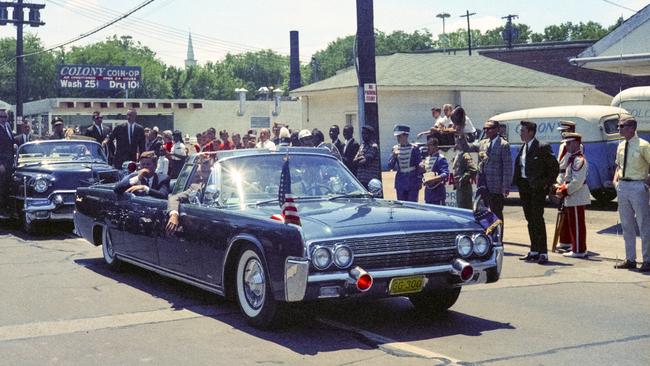 President John F. Kennedy arriving for a campaign visit tin Nashville in 1963 in the same 1961 Lincoln Continental convertible that he was assassinated in six months later in Dallas.