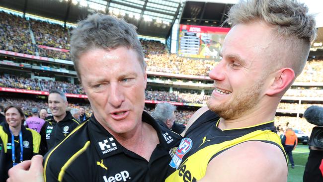 Brandon Ellis celebrates with coach Damien Hardwick after Richmond’s premiership win. Picture: Michael Klein.