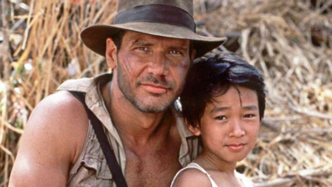 Ke Huy Quan with Harrison Ford in Indiana Jones and the Temple of Doom.