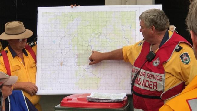 Firefighters discuss their action plan to fight the Taralga fire. Pic: Warren Brown.