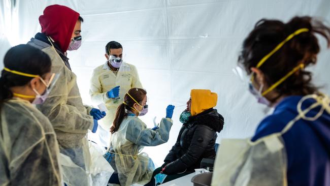 Back in March in New York City, doctors test hospital staff with flu-like symptoms for coronavirus in set-up tents to triage possible COVID-19 patients outside before they enter a hospital emergency department. Picture: AFP