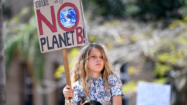 A young protester takes part in the The Global Strike 4 Climate rally in Brisbane. Picture: AAP Image/Dan Peled