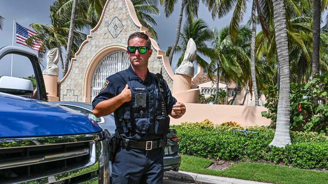 Local law enforcement officer in front of Mar-A-Lago as it is searched by FBI agents for classified documents. Picture: AFP.