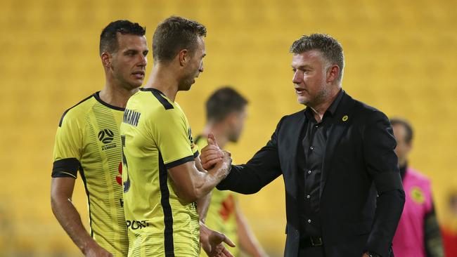 WELLINGTON, NEW ZEALAND - MARCH 15: Matti Steinmann and coach Ufuk Talay of the Phoenix celebrates the win during the round 23 A-League match between Wellington Phoenix and Melbourne Victory at Westpac Stadium on March 15, 2020 in Wellington, New Zealand. (Photo by Hagen Hopkins/Getty Images)