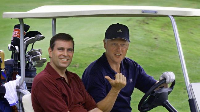 Prince Andrew (l) with USA politician President Bill Clinton in golf cart during round of golf at Farm Neck Golf Club in Martha's Vineyard 27 Aug 1999. British royalty