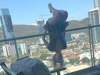 A woman has fallen 25m from her balcony.