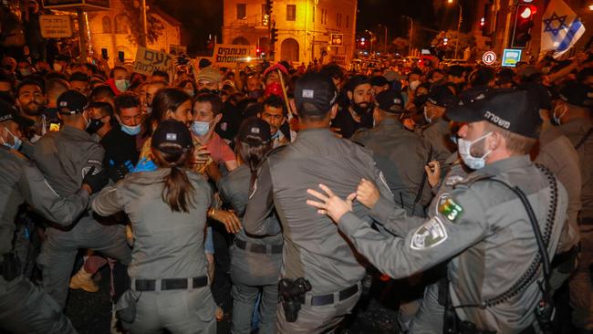 Israeli police bar protesters from advancing during a rally against Prime Minister Benjamin Netanyahu outside his official residence in Jerusalem. Picture: AFP