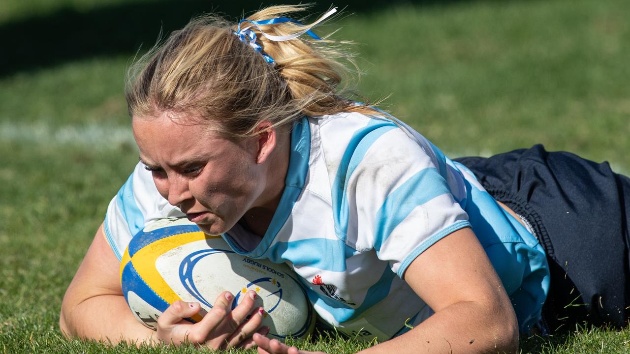 NSW Zara Verman smashes through the ACT’s defence to score.