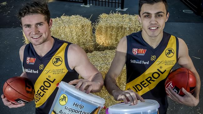 Glenelg players Brad McCarthy and Brad Close show their support for the Buy A Bale campaign to support farmers. Picture: Roy Vandervegt