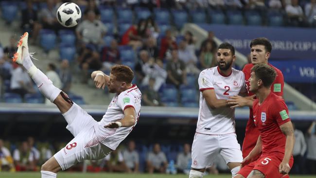 Tunisia's Fakhreddine Ben Youssef goes for a spectacular overhead kick. Picture: AP