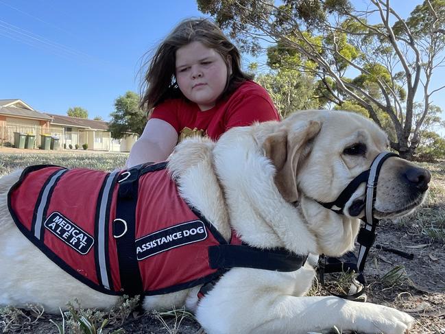 Logan Reese with his assistance dog Hunter. Picture: Dylan Hogarth