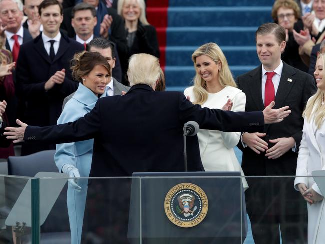 President Donald Trump reaches out to embrace son Barron Trump as First Lady Melania Trump, Ivanka Trump , Eric Trump and Tiffany Trump look on after his inauguration on the West Front of the U.S. Capitol on January 20, 2017 in Washington, DC. Picture: Getty
