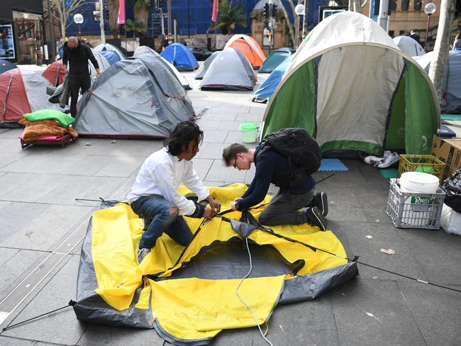 Homeless residents of Tent City pack their belongings. Picture: David Moir