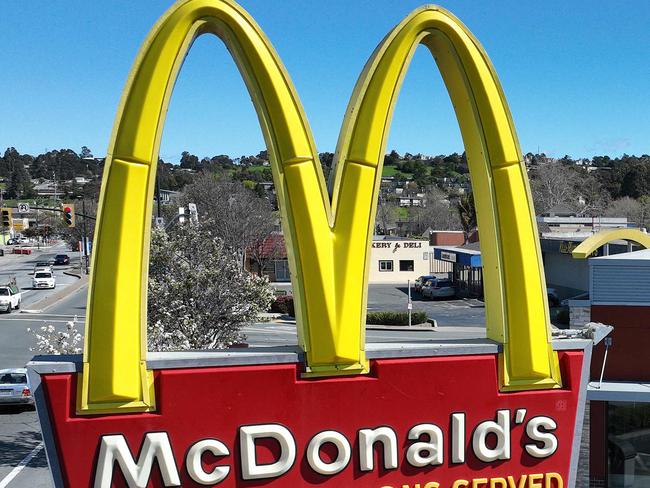 SAN PABLO, CALIFORNIA - APRIL 03: In an aerial view, a sign is posted in front of a McDonald's restaurant on April 03, 2023 in San Pablo, California. Fast food chain restaurant McDonald's is shuttering its U.S. offices this week as the company prepares to restructure and inform employees about layoffs.   Justin Sullivan/Getty Images/AFP (Photo by JUSTIN SULLIVAN / GETTY IMAGES NORTH AMERICA / Getty Images via AFP)