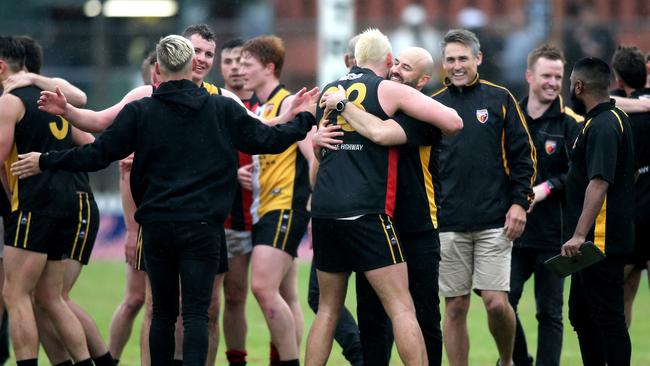 Goodwood coach Luke Donaldson hugs ruckman, Tom Carter after the Saints won the top tier Adelaide Footy League grand final. Picture: Dean Martin