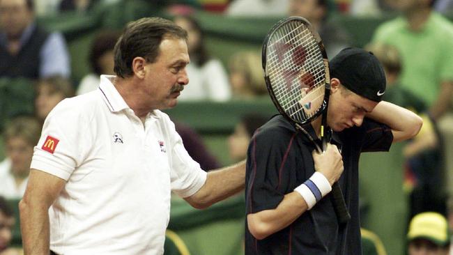 Lleyton Hewitt (right) receives encouragement from team captain John Newcombe during the 2000 Davis Cup Final in Barcelona. Picture: File