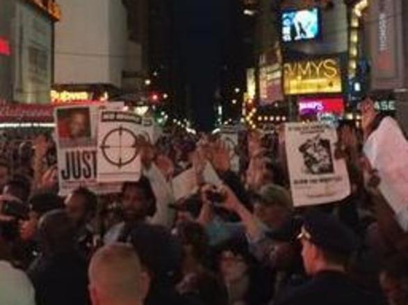 Thousands rally in Times Square following Ferguson death. Source: Twitter @connortryan