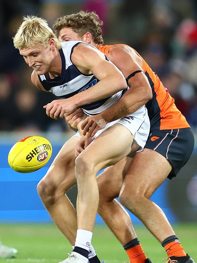 Mitch Knevitt cops heat from Harry Perryman. Picture: Mark Metcalfe/AFL Photos/via Getty Images