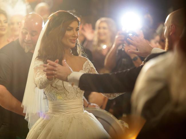 Salim Mehajer’s sister Kat and her new husband Ibraham making their entrance to their wedding reception held at Doltone House, Hyde Park. Picture: Jonathan Ng.