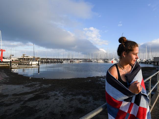 Emmie stands on the pier overlooking Sandringham Beach’s sludge. Picture: Penny Stephens