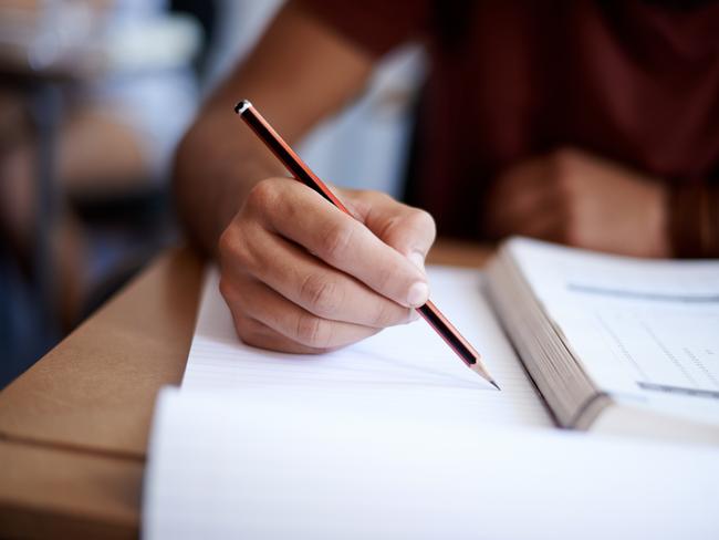 Close up of hands of a student during an exam. Picture: istock