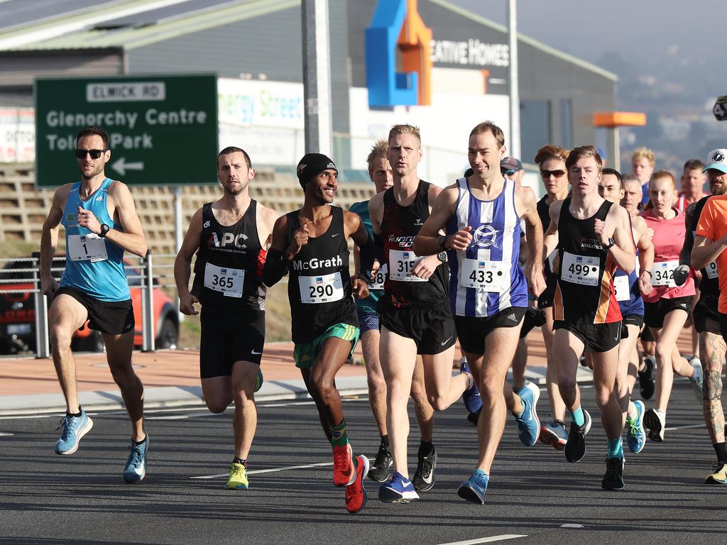 11km men's winner Dejen Gebreselassie (centre) at the start of the race. Picture: LUKE BOWDEN