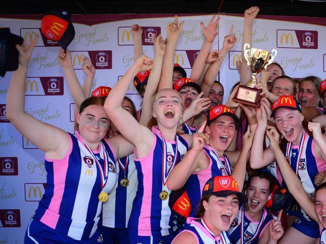 Mt Gravatt celebrate a 2020 grand final win.