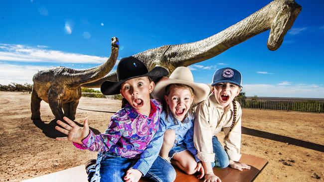 Rae Batey, 7, Brooklyn Lavington, 4, and Summer Kennedy, 7, are excited to check out the multimillion-dollar expansion to the Australian Age of Dinosaurs museum in Winton. Picture: NIGEL HALLETT