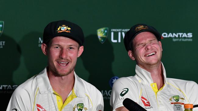 Cameron Bancroft and Steve Smith reacting in an Ashes press conference. Picture: AAP Image/Darren England