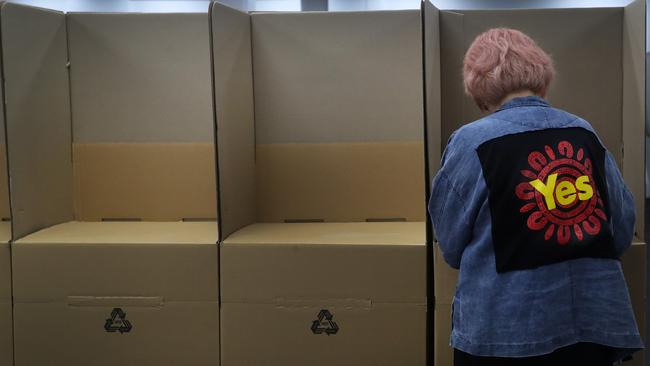 A member of the public casts an early vote at a polling centre in the Sydney CBD