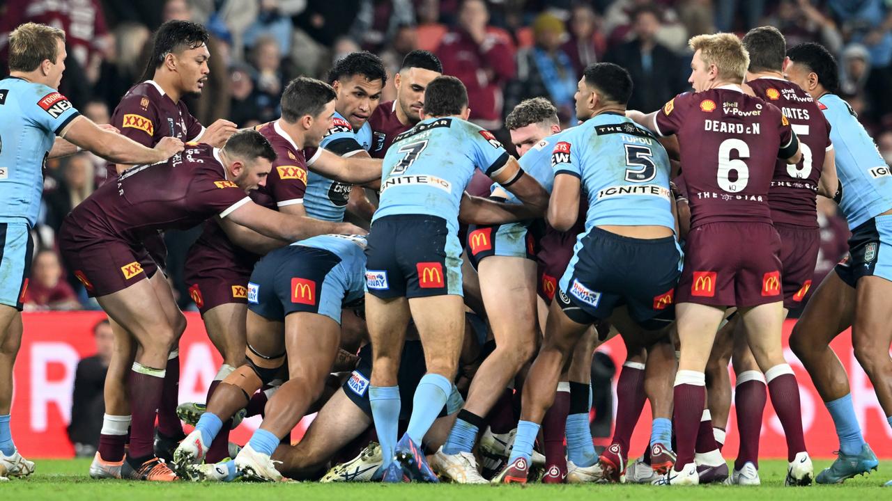 Players scuffle during game three of the State of Origin Series between the Queensland Maroons (Photo by Bradley Kanaris/Getty Images)