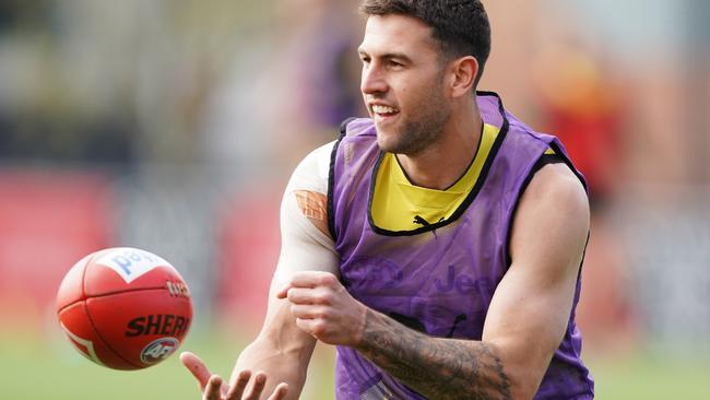 Jack Graham tests his sore shoulder at Richmond training today.