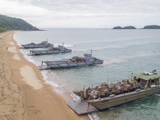 An Australian Army LCM-8 Landing Craft and Royal Australian Navy LHD Landing Crafts carry M1A1 Abrams Main Battle Tanks, M113 Armoured Personnel Carriers and Australian Light Armoured Vehicles, during an amphibious beach assault, as part of Exercise Sea Explorer, Cowley Beach, Queensland. *** Local Caption *** Exercise Sea Explorer is the 2nd of 3 exercises in the annual Sea Series to hone and certify Australia’s Amphibious Forces. The first exercise, Sea Horizon, was a planning exercise in preparation for the subsequent Sea Explorer and Raider exercises. During Exercise Sea Explorer, almost 1800 soldiers, sailors and aviators aboard HMAS’ Canberra and Choules will practice amphibious landings of soldiers, vehicles and equipment onto Cowley Beach in North-eastern Queensland from 2-15 June, 2021.