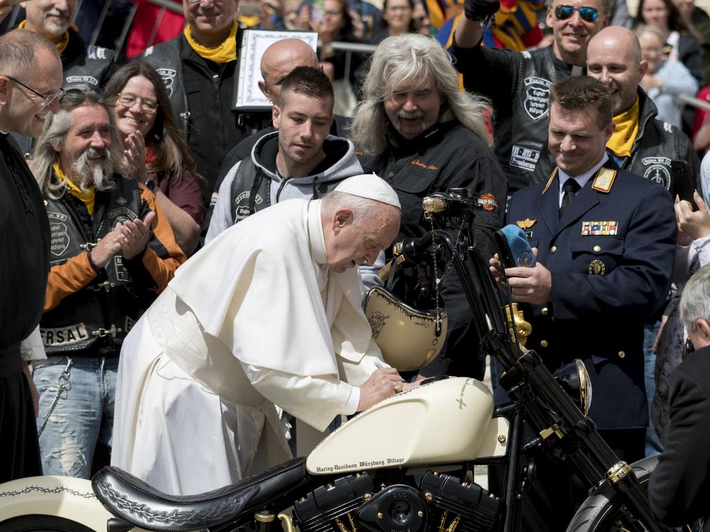 Pope Francis signs a Harley Davidson motorbike – aka ‘Holy Davidson’ – brought by members of an association of Jesus Bikers International who attended his weekly general audience, in St. Peter's Square at the Vatican, on May 29, 2019. Picture: NurPhoto via Getty Images